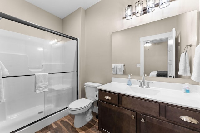 440 Lake Front Dr, Branson, MO 65616 - bathroom featuring wood finished floors, vanity, connected bathroom, and a shower stall