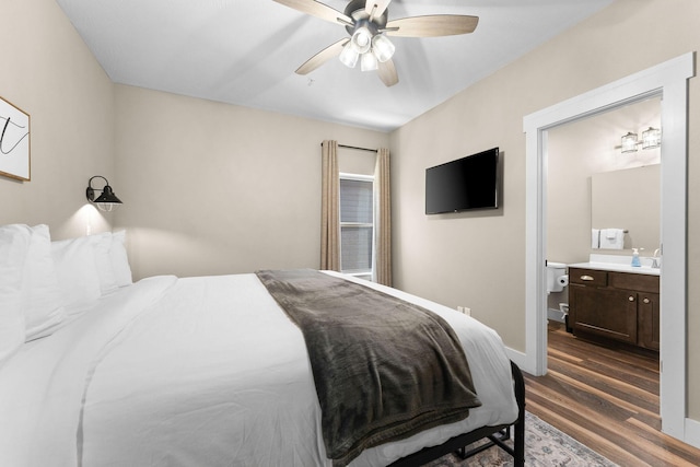 440 Lake Front Dr, Branson, MO 65616 - bedroom with dark wood-style floors, connected bathroom, a ceiling fan, and baseboards