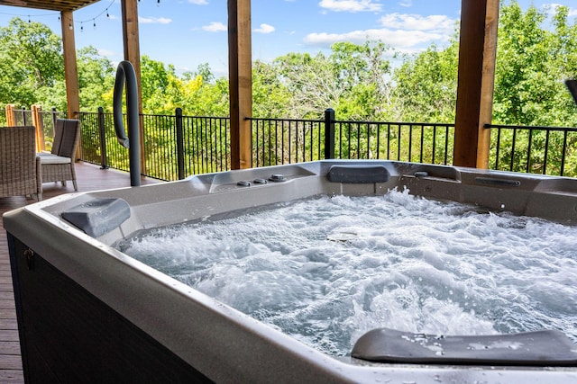440 Lake Front Dr, Branson, MO 65616 - view of patio / terrace with a hot tub, view of wooded area, and a deck
