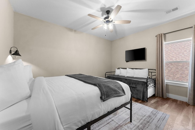 440 Lake Front Dr, Branson, MO 65616 - bedroom with baseboards, wood finished floors, and ceiling fan