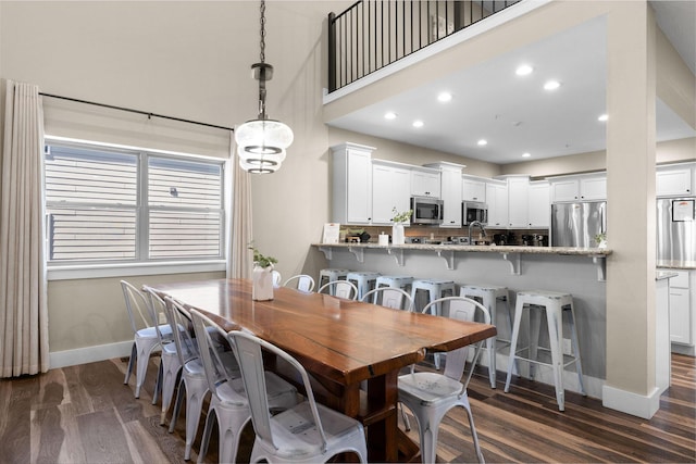 440 Lake Front Dr, Branson, MO 65616 - dining area with baseboards, dark wood finished floors, a towering ceiling, and recessed lighting
