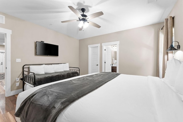 440 Lake Front Dr, Branson, MO 65616 - bedroom featuring wood finished floors, baseboards, a ceiling fan, and ensuite bathroom