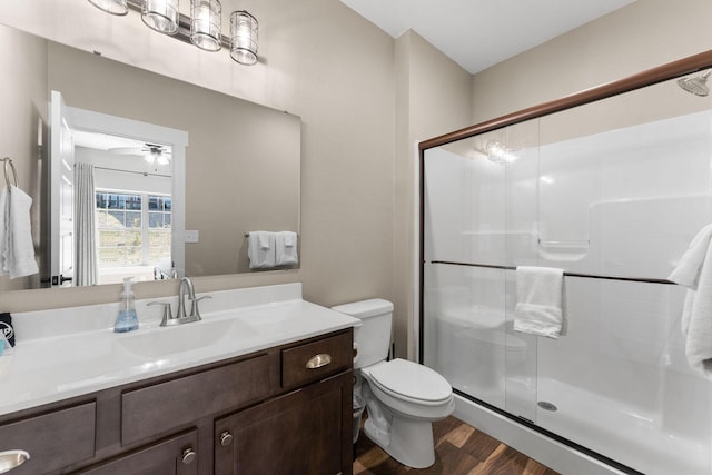 440 Lake Front Dr, Branson, MO 65616 - bathroom featuring wood finished floors, a shower stall, toilet, and vanity