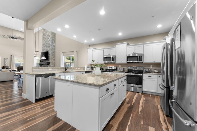 440 Lake Front Dr, Branson, MO 65616 - kitchen featuring stainless steel appliances, recessed lighting, a sink, tasteful backsplash, and white cabinets
