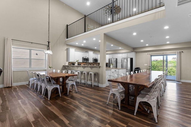 440 Lake Front Dr, Branson, MO 65616 - dining room featuring baseboards, dark wood-type flooring, a high ceiling, and recessed lighting