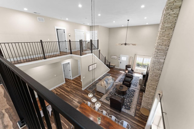440 Lake Front Dr, Branson, MO 65616 - stairway featuring wood finished floors, recessed lighting, a towering ceiling, baseboards, and a chandelier
