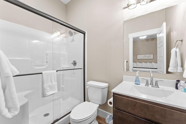 440 Lake Front Dr, Branson, MO 65616 - bathroom with a stall shower, vanity, toilet, and ensuite bath
