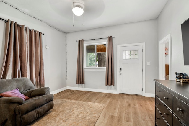 1609 N Lyon Ave, Springfield, MO 65803 - foyer featuring light wood-style floors, baseboards, and ceiling fan