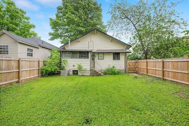 1609 N Lyon Ave, Springfield, MO 65803 - rear view of house with entry steps and central AC unit