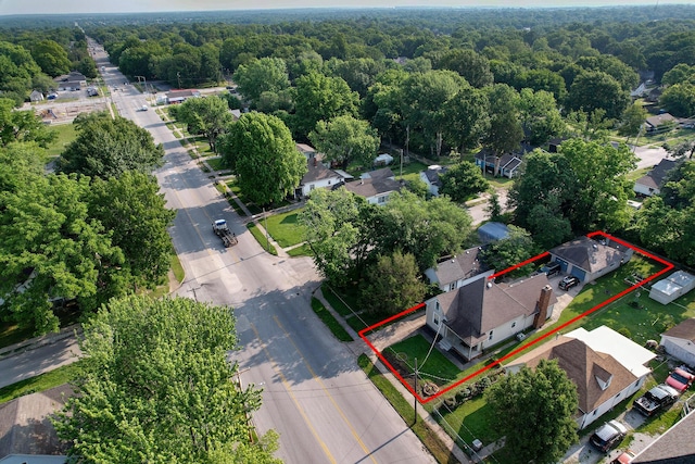 2052 N Grant Ave, Springfield, MO 65803 - aerial perspective of suburban area with a forest and property parcel outlined