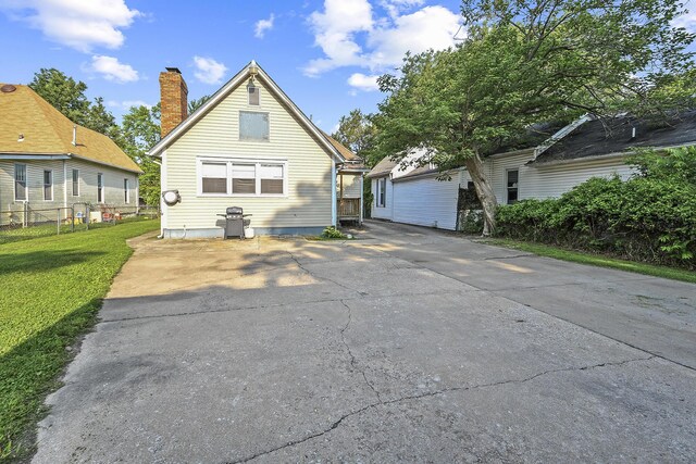 2052 N Grant Ave, Springfield, MO 65803 - back of house with a chimney