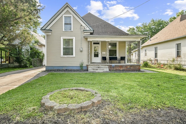 2052 N Grant Ave, Springfield, MO 65803 - shotgun-style home with covered porch and a shingled roof