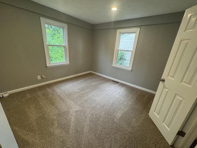 2152 E Cairo St, Springfield, MO 65802 - unfurnished room with plenty of natural light, baseboards, and dark colored carpet