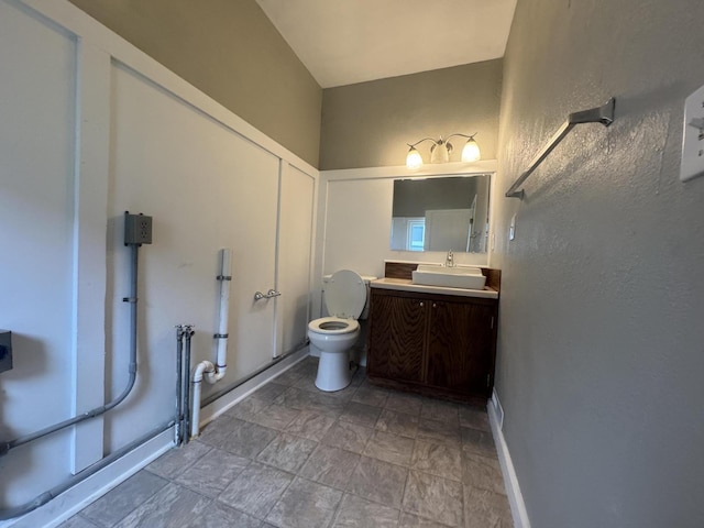 2152 E Cairo St, Springfield, MO 65802 - bathroom featuring vanity, toilet, and stone finish flooring