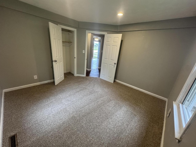 2152 E Cairo St, Springfield, MO 65802 - unfurnished bedroom featuring multiple windows, baseboards, carpet flooring, and recessed lighting