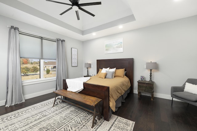 7015 Calabash St, Nixa, MO 65714 - bedroom featuring a raised ceiling, recessed lighting, baseboards, wood finished floors, and ceiling fan