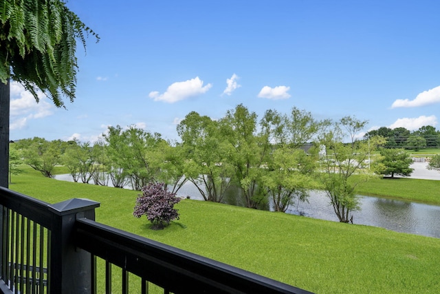 7015 Calabash St, Nixa, MO 65714 - view of grassy yard with a water view, a balcony, and view of scattered trees