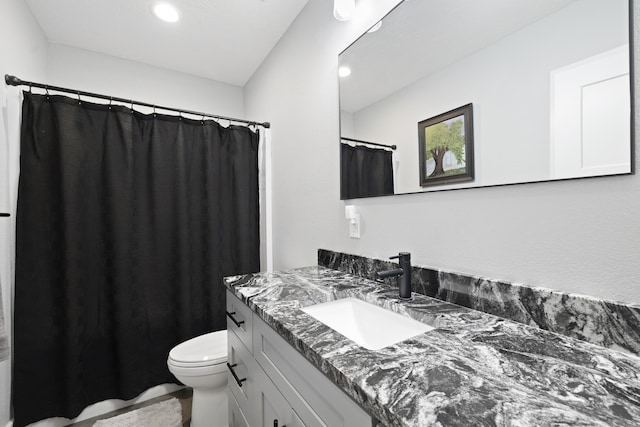 7015 Calabash St, Nixa, MO 65714 - full bath with toilet, vanity, a shower with shower curtain, and recessed lighting