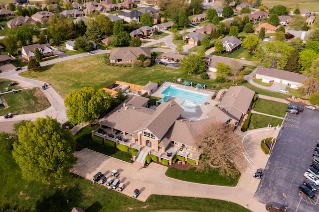 7015 Calabash St, Nixa, MO 65714 - aerial overview of property's location with a pool area and nearby suburban area