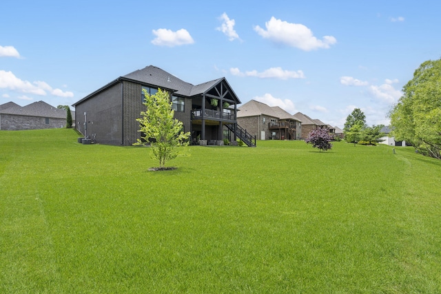 7015 Calabash St, Nixa, MO 65714 - view of green lawn featuring stairs and a wooden deck
