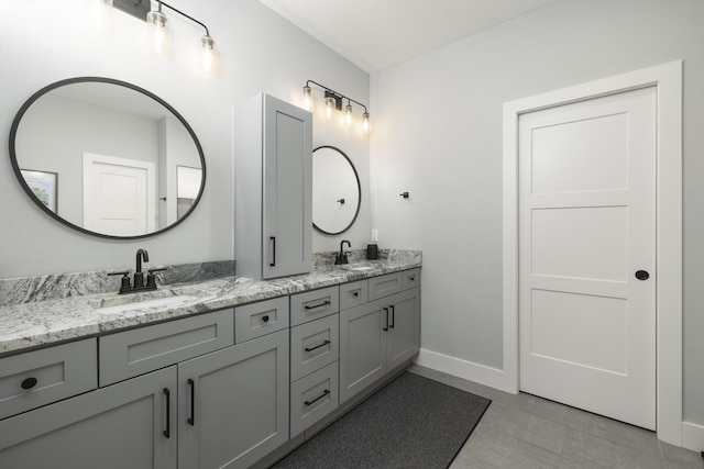 7015 Calabash St, Nixa, MO 65714 - full bathroom with double vanity and baseboards