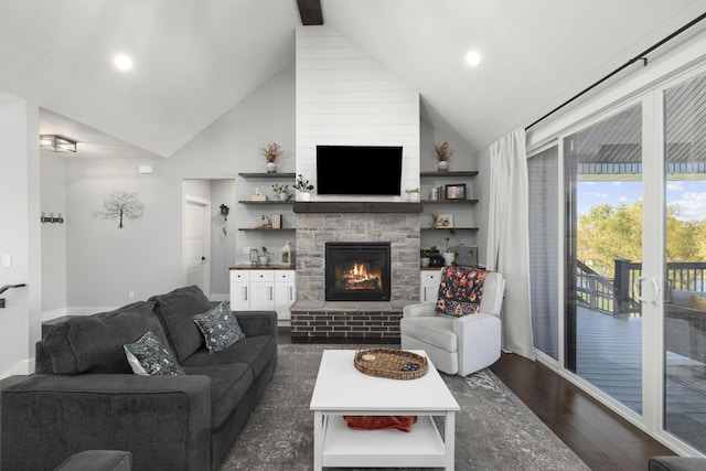 7015 Calabash St, Nixa, MO 65714 - living area with a stone fireplace, high vaulted ceiling, dark wood finished floors, recessed lighting, and baseboards