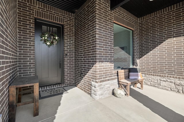 7015 Calabash St, Nixa, MO 65714 - entrance to property featuring brick siding and covered porch
