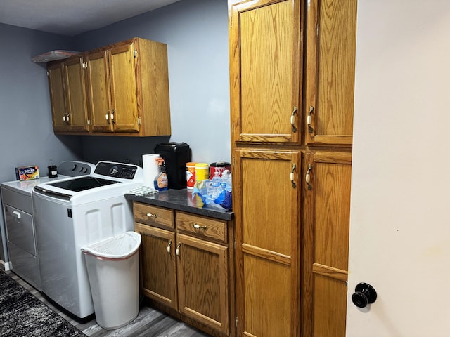 27641 County Road 356, Pittsburg, MO 65724 - laundry area featuring independent washer and dryer, cabinet space, and wood finished floors
