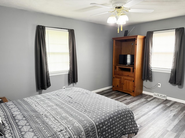 27641 County Road 356, Pittsburg, MO 65724 - bedroom featuring wood finished floors, baseboards, and ceiling fan