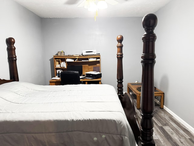 27641 County Road 356, Pittsburg, MO 65724 - bedroom featuring wood finished floors, baseboards, and a ceiling fan