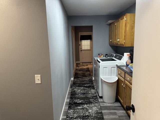 27641 County Road 356, Pittsburg, MO 65724 - laundry room featuring cabinet space, washing machine and dryer, dark wood-type flooring, and baseboards