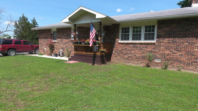 27641 County Road 356, Pittsburg, MO 65724 - ranch-style home featuring covered porch, a front yard, brick siding, and crawl space