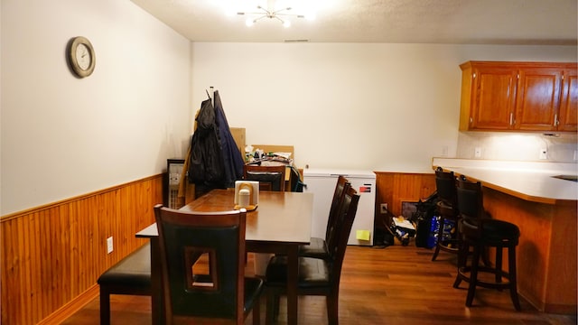 4287 Olga Rd, Fordland, MO 65652 - dining area featuring dark wood-type flooring, a wainscoted wall, and wooden walls