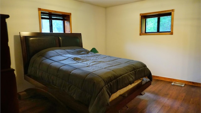 4287 Olga Rd, Fordland, MO 65652 - bedroom featuring baseboards, multiple windows, and wood finished floors
