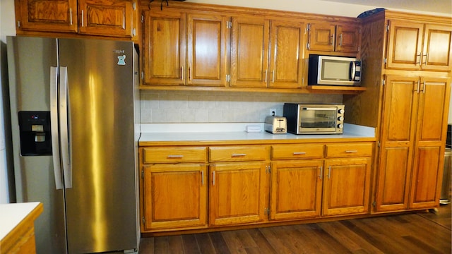 4287 Olga Rd, Fordland, MO 65652 - kitchen with stainless steel appliances, light countertops, and brown cabinetry