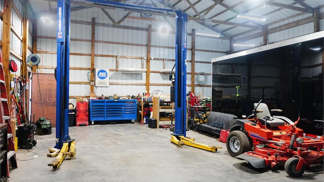 4287 Olga Rd, Fordland, MO 65652 - garage featuring a workshop area and metal wall