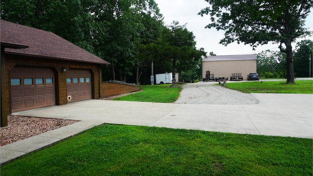 4287 Olga Rd, Fordland, MO 65652 - view of grassy yard with a garage and concrete driveway