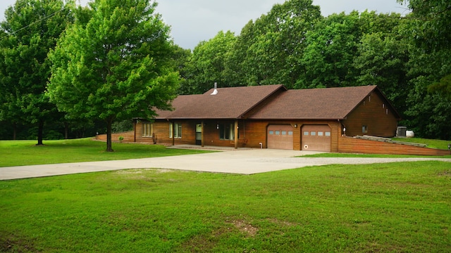 4287 Olga Rd, Fordland, MO 65652 - view of front of home featuring driveway, an attached garage, and a front yard