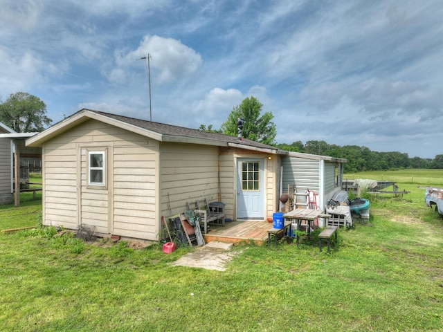 1142 Rte F, Anderson, MO 64831 - rear view of house with a yard and a wooden deck