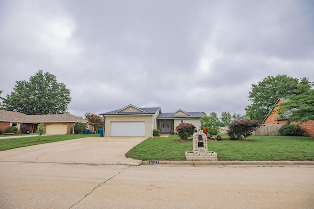 1603 W Northwood St, Bolivar, MO 65613 - view of front of property with driveway and a garage
