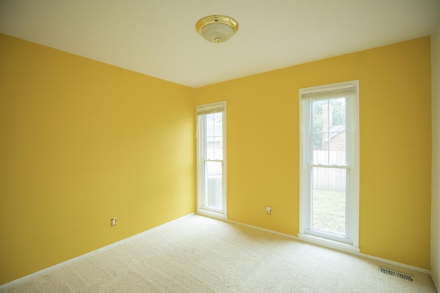 1603 W Northwood St, Bolivar, MO 65613 - spare room with plenty of natural light, carpet floors, and baseboards