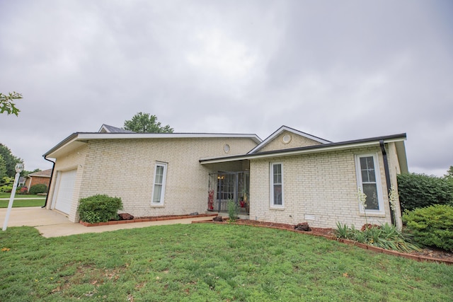 1603 W Northwood St, Bolivar, MO 65613 - view of front of home with brick siding, a front lawn, a garage, and concrete driveway
