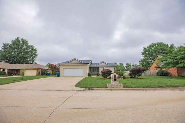 1603 W Northwood St, Bolivar, MO 65613 - view of front of home featuring concrete driveway and an attached garage