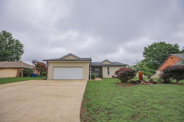 1603 W Northwood St, Bolivar, MO 65613 - view of front of house with concrete driveway, brick siding, an attached garage, and a front yard