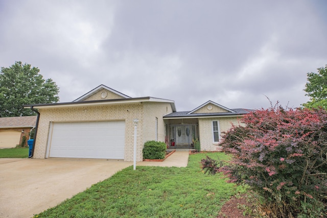 1603 W Northwood St, Bolivar, MO 65613 - single story home with a garage, concrete driveway, brick siding, and a front lawn