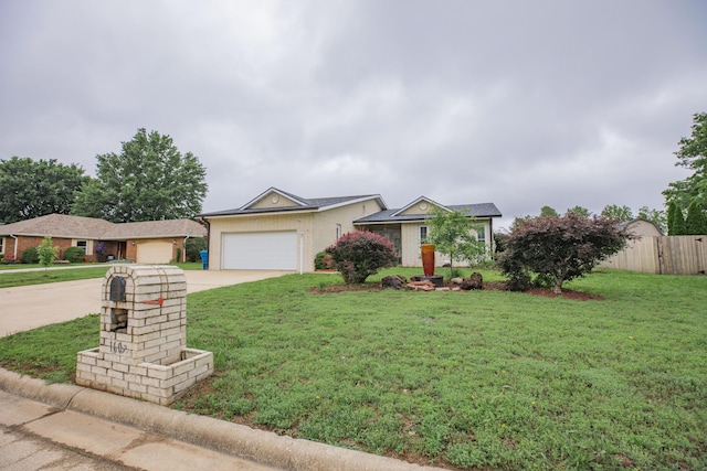 1603 W Northwood St, Bolivar, MO 65613 - ranch-style house with driveway, a garage, and stucco siding