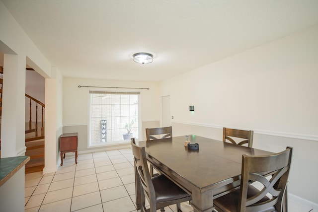 1603 W Northwood St, Bolivar, MO 65613 - dining space with stairway, light tile patterned flooring, and baseboards
