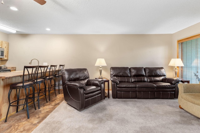 550 Notch Ln Unit 2, Reeds Spring, MO 65737 - living room featuring a textured ceiling, recessed lighting, light colored carpet, and ceiling fan