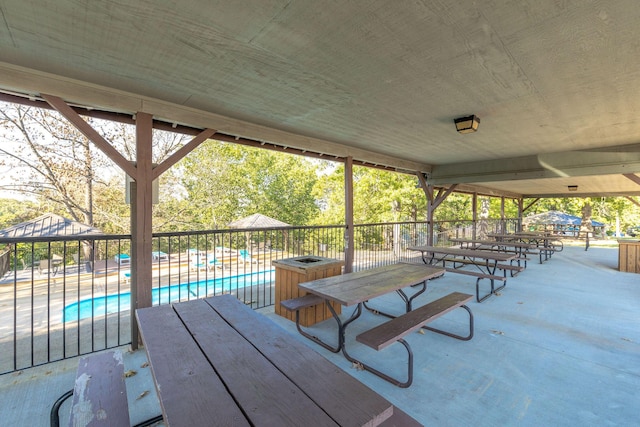 550 Notch Ln Unit 2, Reeds Spring, MO 65737 - wooden deck featuring a community pool and a patio area