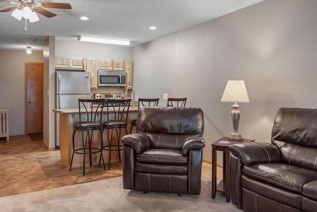 550 Notch Ln Unit 2, Reeds Spring, MO 65737 - living area featuring light carpet, a ceiling fan, recessed lighting, baseboards, and a textured ceiling